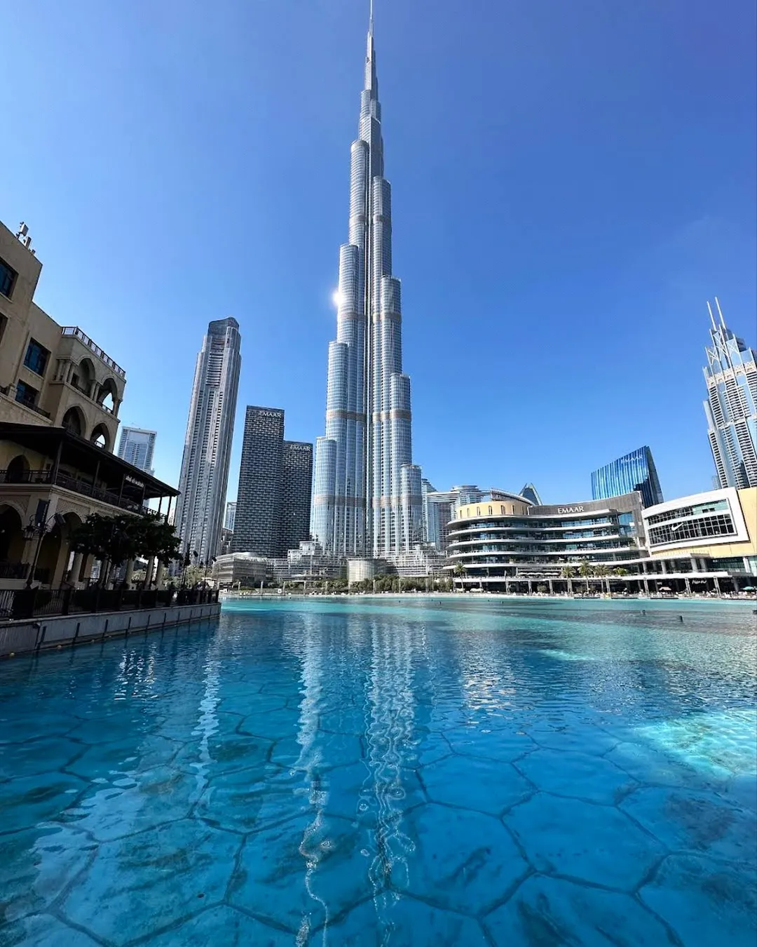 Burj Khalifa reflected in the Dubai Fountain lake