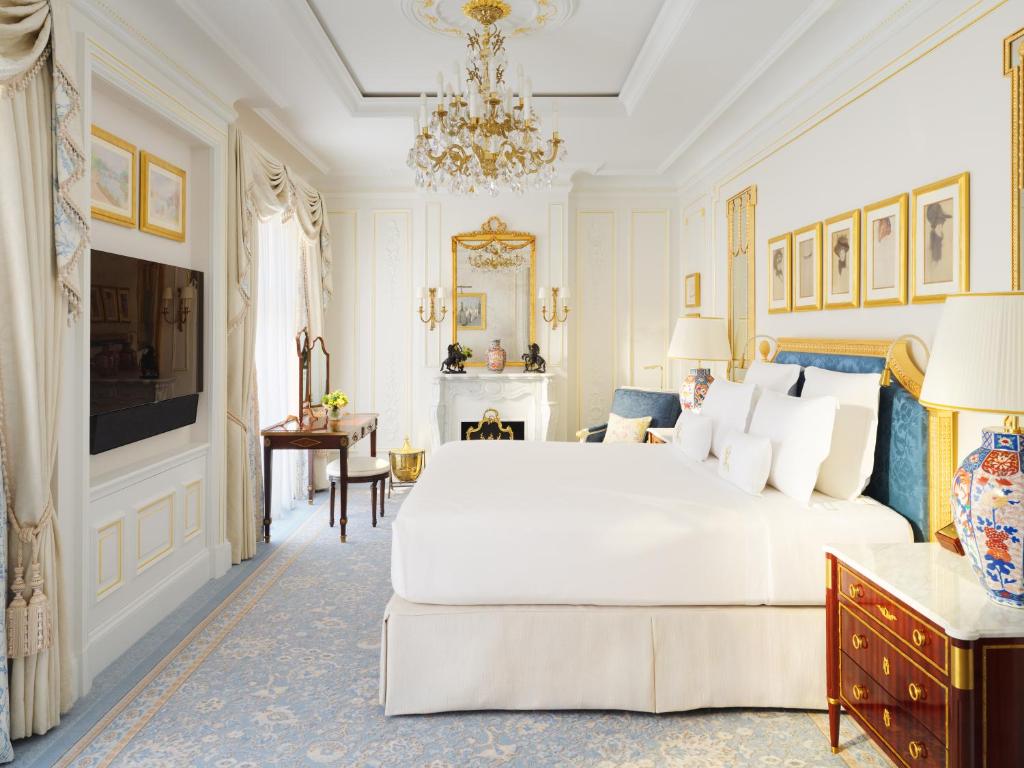 A gold and blue guest room at The Ritz London