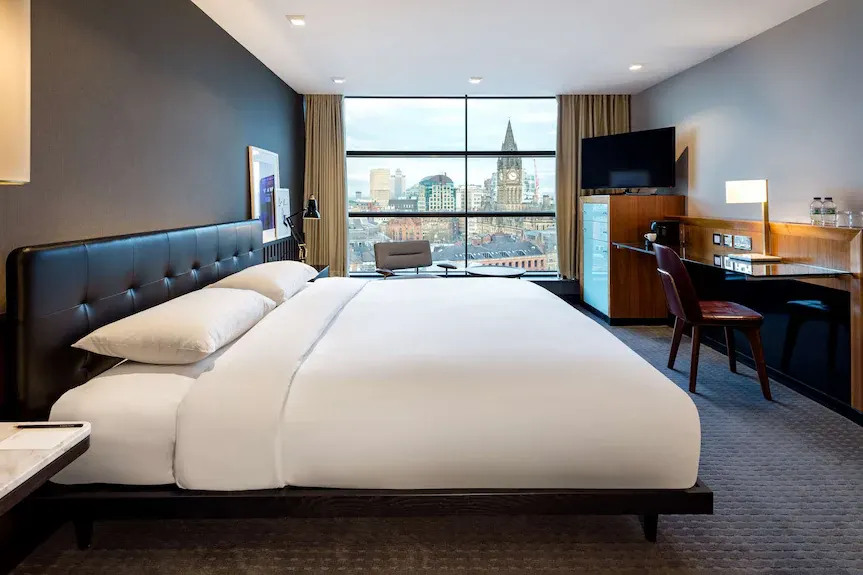 Hotel room with a Manchester skyline view at The Edwardian Manchester
