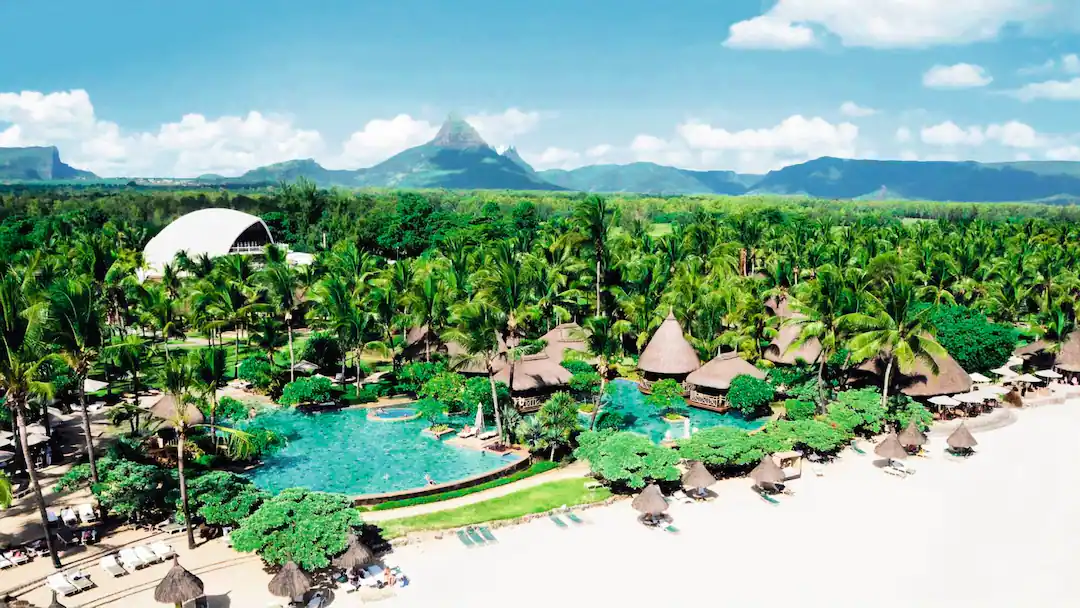 Hotel La Pirogue thatched buildings and pool