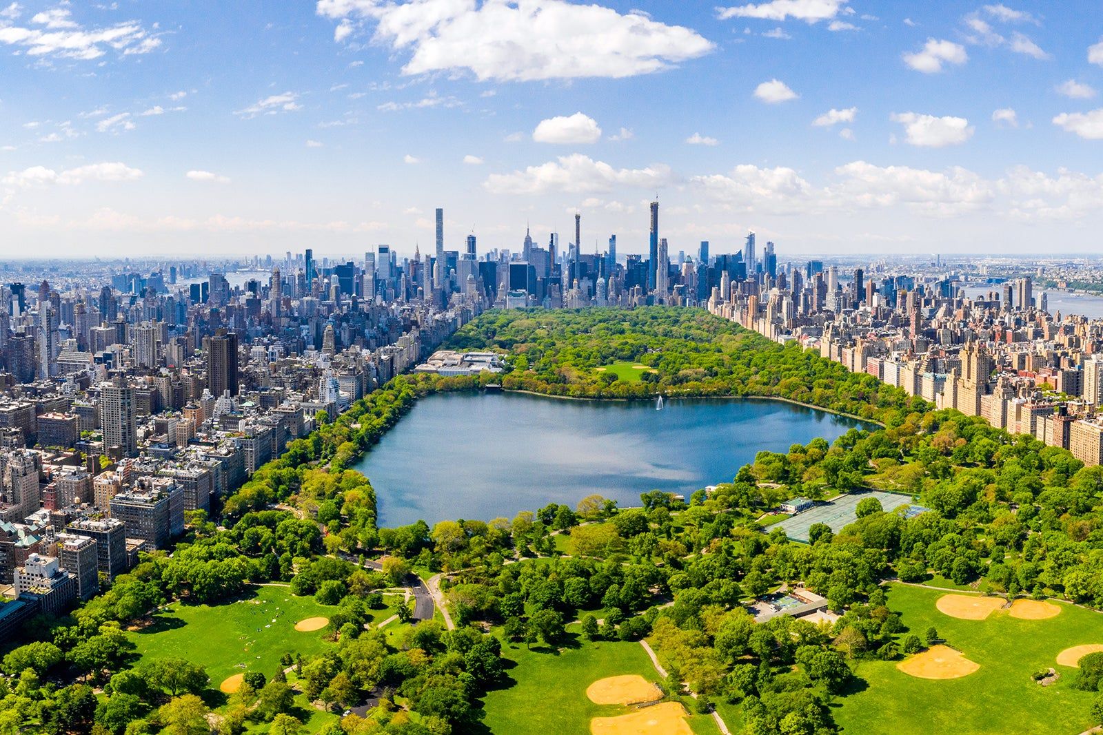 Aerial view of Central Park and the reservoir with Manhattan skyline behind