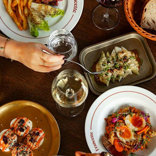 A shared table of bistro dishes at Francette