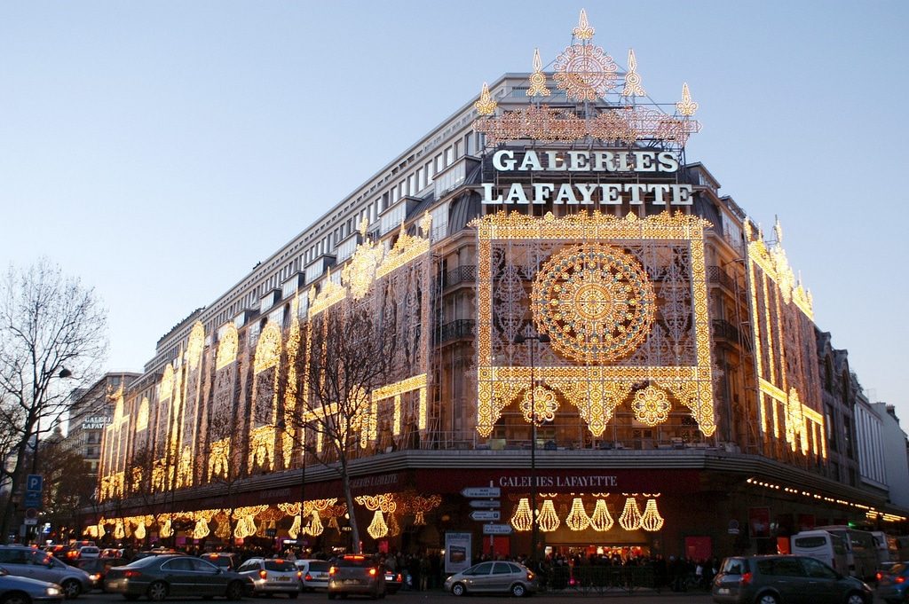 The illuminated facade of Galeries Lafayette department store