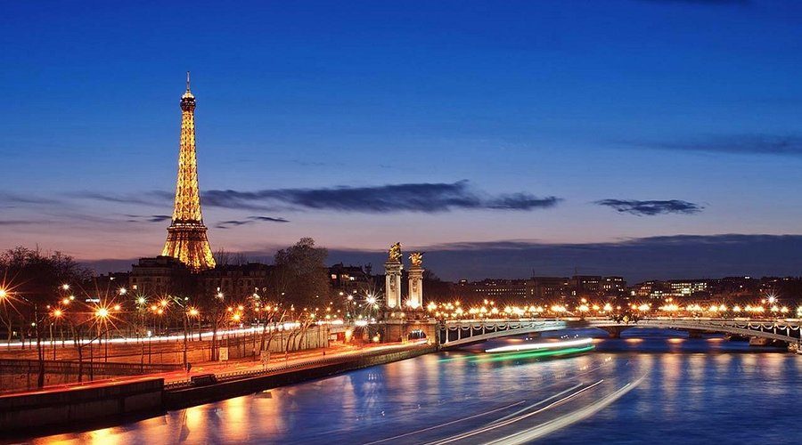 The Eiffel Tower and the Seine at night